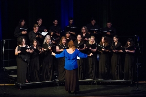 Edlyn de Oliveria, instructor of Music at Palo Alto College, leads the Palo Alto Choir during the Hurricane Harvey Relief Concert on Sept. 26, 2017.